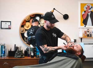 Barber doing beard service in Allen Texas