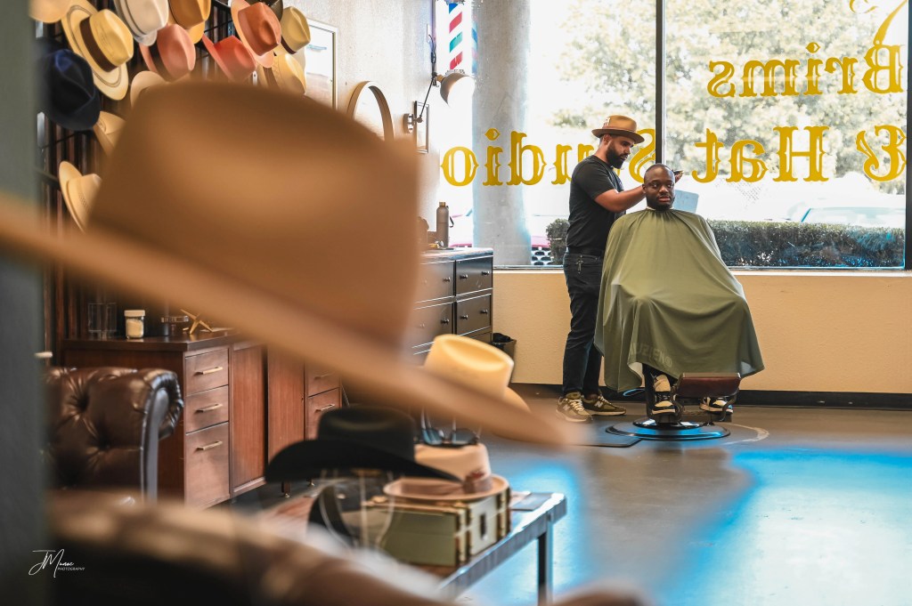 Barber Cutting hair in Allen Texas Barbershop